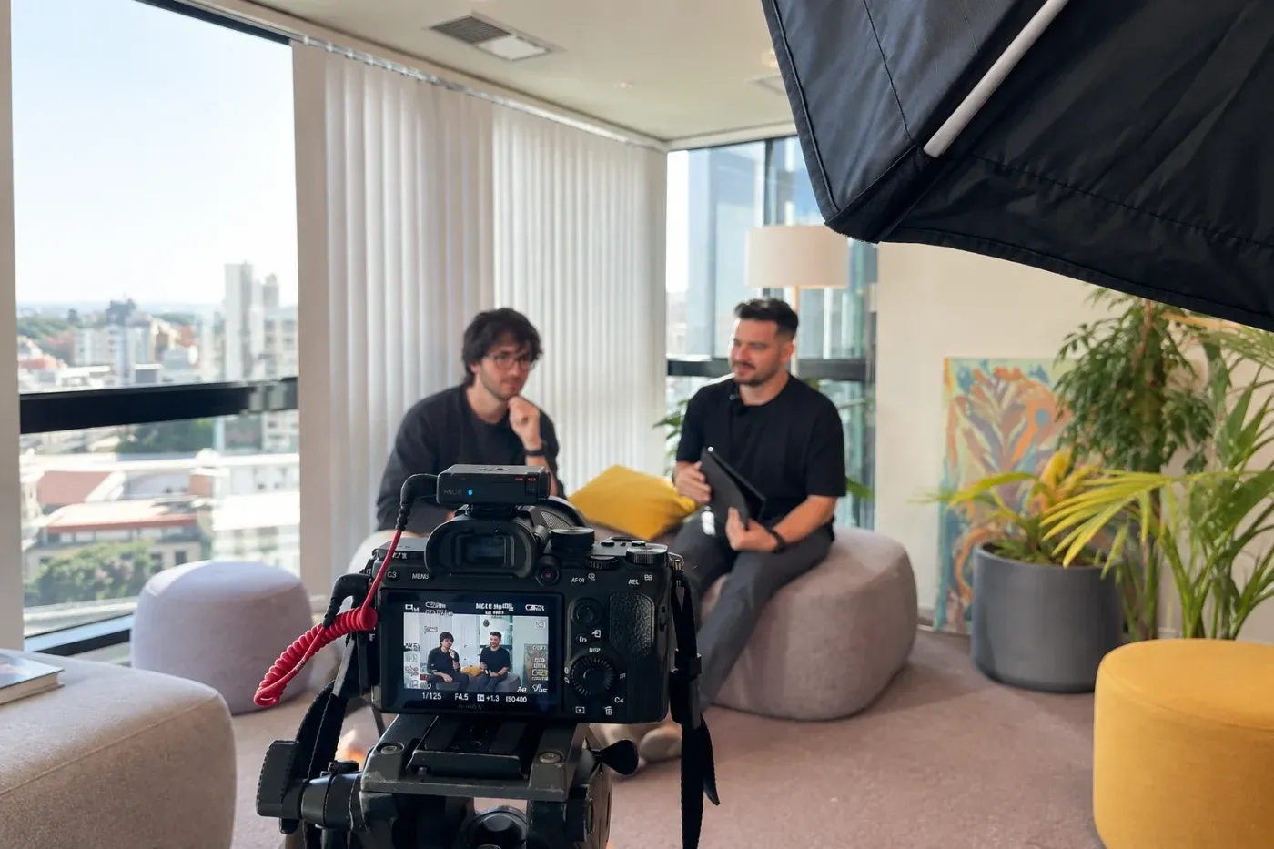 The Localizr team filming a client interview in the office