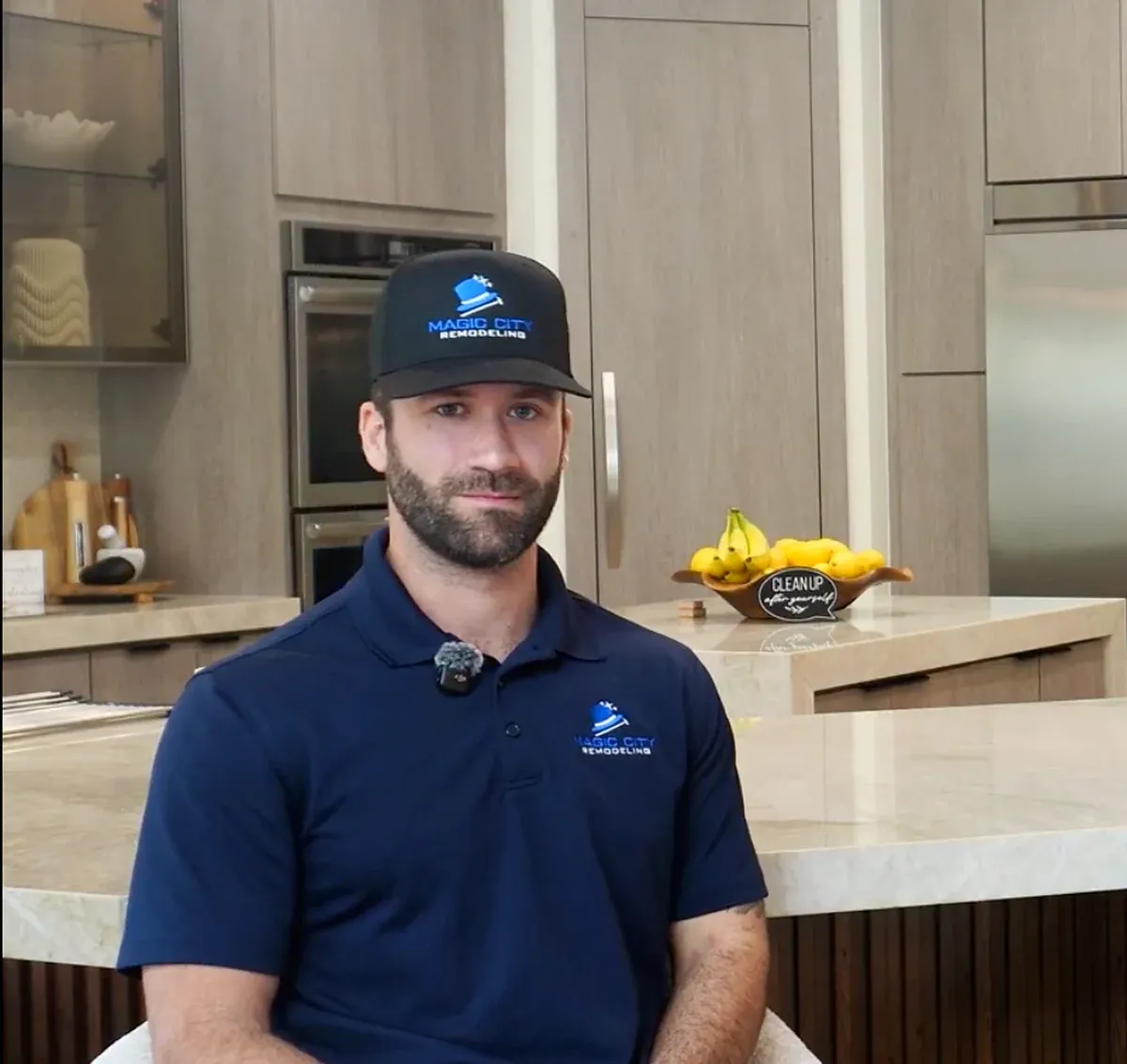 Magic City Remodeling's owner on camera in a finished kitchen